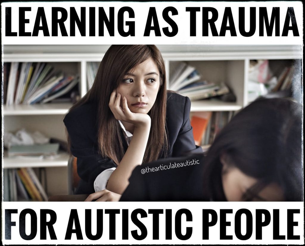  teenage girl with auburn hair with her hand resting on her chin, looking away while sitting in a classroom with text that reads, "Learning as trauma for autistic people".