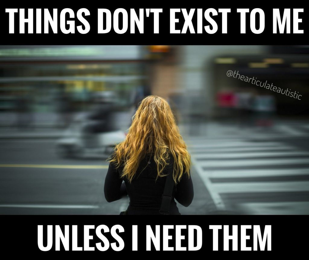 Red-headed woman in a black coat about to cross a busy street, which is blurred out in the background. Text reads, "Things don't exist to me unless I need them"