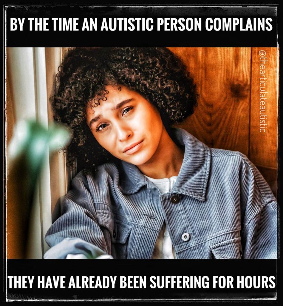 African American woman looking directly at the camera, looking upset and on the verge of tears. Text reads, "By The Time An Autistic Person Complains, They Have Already Been Suffering For Hours". 