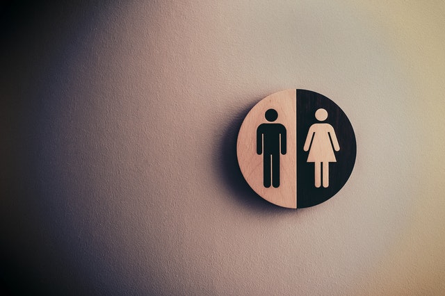 A black and white bathroom/restroom sign. 