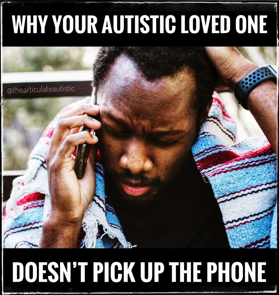 Man wearing a colorful shawl while talking on the phone. His eyes are closed, and his hand is on his head. He looks stressed or like he's concentrating hard. 