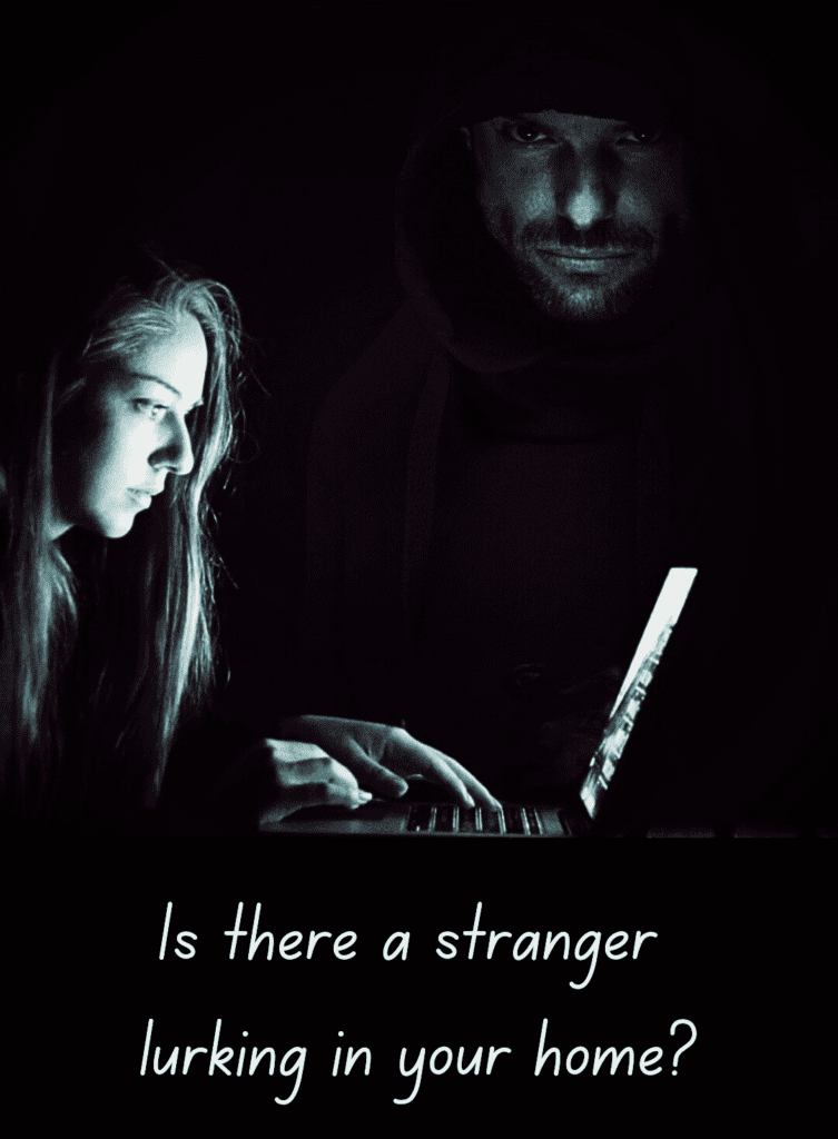 Blonde-haired woman looking at a laptop in the dark while a man with a hooded sweatshirt looms threateningly out of the darkness surrounding her