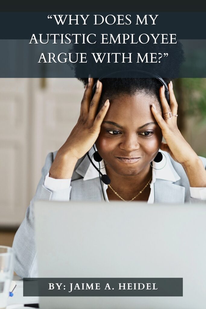 Woman wearing a headset sits in a home office in front of a computer. She holds her head in her hands and grimaces at the screen