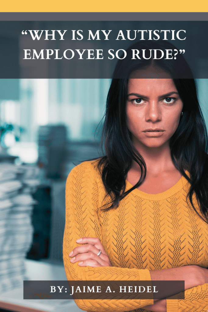 Woman with long, dark hair and dark eyes wearing a yellow sweater and standing in front of a blurry office backdrop crosses her arms in front of her chest and stares into the camera with an angry look.