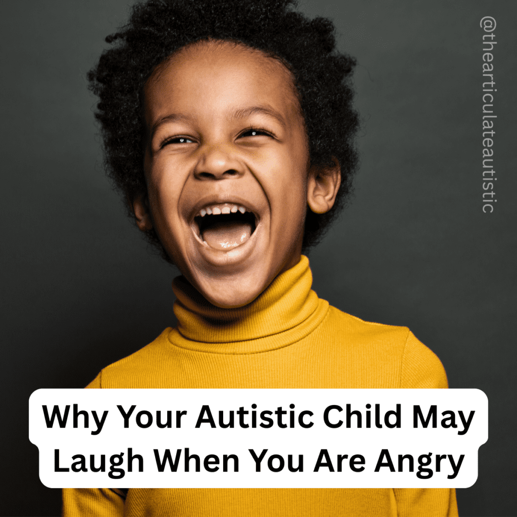 Young child in a yellow turtleneck laughs happily 
